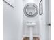 Modern powder room featuring a pedestal sink, decorative mirror, and clean, minimalist design at 266 Ivory Shadow Rd, Summerville, SC 29486