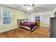 Sunny bedroom with hardwood floors, ceiling fan, and plenty of natural light at 2665 Ranger Dr, North Charleston, SC 29405