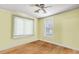 Bedroom with light-colored walls, hardwood floors, and two large windows at 2665 Ranger Dr, North Charleston, SC 29405