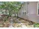Long driveway leading to garage behind house with vinyl siding and brick foundation at 2665 Ranger Dr, North Charleston, SC 29405