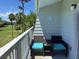 Cozy balcony with comfortable seating offers a picturesque view of a lush green golf course at 287 Driftwood Ln, Edisto Beach, SC 29438