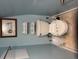 Well-maintained toilet in a clean bathroom with matching colored walls and trim at 287 Driftwood Ln, Edisto Beach, SC 29438