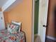 Cozy bedroom with ensuite view, featuring floral bedding, and a small window at 287 Driftwood Ln, Edisto Beach, SC 29438