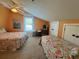 Bright bedroom featuring twin beds, a ceiling fan, and natural light from the window at 287 Driftwood Ln, Edisto Beach, SC 29438