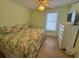 Inviting bedroom with a comfortable bed, dresser, and lots of natural light from the window at 287 Driftwood Ln, Edisto Beach, SC 29438