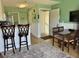Inviting dining area with counter seating and table and chairs; ideal for enjoying meals at 287 Driftwood Ln, Edisto Beach, SC 29438