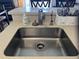 Close-up view of a kitchen sink with modern fixtures and accessories at 287 Driftwood Ln, Edisto Beach, SC 29438
