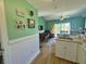 Open-concept living space with kitchen, dining area, and seating for entertainment at 287 Driftwood Ln, Edisto Beach, SC 29438