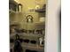 Organized pantry with wire shelving, stocked with cookware, kitchen appliances, and food storage at 287 Driftwood Ln, Edisto Beach, SC 29438