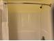 Clean shower with white tile surround and a shower curtain at 287 Driftwood Ln, Edisto Beach, SC 29438