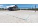 Beach volleyball court with fine white sand, ready for friendly matches and fun at 287 Driftwood Ln, Edisto Beach, SC 29438