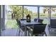 Outdoor dining space on the covered balcony overlooking the golf course at 2909 Atrium Villa, 9, Seabrook Island, SC 29455