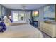 The bedroom offers two beds, a TV, balcony access, and a light-filled interior to enjoy your stay in comfort and style at 2909 Atrium Villa, 9, Seabrook Island, SC 29455
