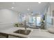 A well-lit kitchen featuring granite countertops, stainless steel appliances, and a view into the living area at 2909 Atrium Villa, 9, Seabrook Island, SC 29455