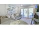 Cozy living room with a comfortable sofa, dining table, and sliding glass doors to the balcony at 2909 Atrium Villa, 9, Seabrook Island, SC 29455