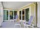 A cozy outdoor patio features comfortable lounge chairs and plenty of space to relax, and access to the interior living areas at 2909 Atrium Villa, 9, Seabrook Island, SC 29455