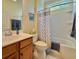 Bathroom featuring a shower and tub combo with vanity and wood cabinets at 310 Waterlily Way, Summerville, SC 29486