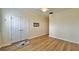 Open bedroom space with hardwood floors, white trim and a ceiling fan at 310 Waterlily Way, Summerville, SC 29486
