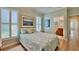 Inviting bedroom featuring plantation shutters and an ensuite bathroom at 310 Waterlily Way, Summerville, SC 29486