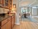 Dining room with hardwood floors, elegant lighting and views to the entry at 310 Waterlily Way, Summerville, SC 29486
