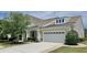 Charming home with a two-car garage and inviting front yard at 310 Waterlily Way, Summerville, SC 29486