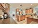 Modern kitchen with granite countertops, wood cabinets, and stainless steel appliances at 310 Waterlily Way, Summerville, SC 29486
