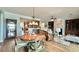 Open-concept living area features dining space, fireplace, and views of the kitchen at 310 Waterlily Way, Summerville, SC 29486