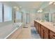 Bright bathroom with double vanity, soaking tub, and separate shower at 310 Waterlily Way, Summerville, SC 29486