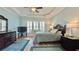 Relaxing bedroom with ceiling fan, tray ceiling, and plantation shutters for privacy at 310 Waterlily Way, Summerville, SC 29486
