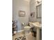 Clean and tidy powder room with pedestal sink and modern fixtures at 310 Waterlily Way, Summerville, SC 29486