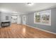 Open-concept living area with wood floors connecting to the kitchen; bright interior at 3113 Matipan Ave, North Charleston, SC 29405