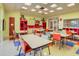 Activity room with tables and chairs, colorful decor, and ample natural light at 349 Waterlily Way, Summerville, SC 29486