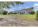 Spacious backyard with a well-maintained lawn, multiple windows, and neutral siding at 349 Waterlily Way, Summerville, SC 29486