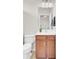 Functional half bathroom showcasing a sink, toilet, vanity with storage, and an adjacent shower at 349 Waterlily Way, Summerville, SC 29486