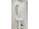 Well-lit half bathroom showcasing a pedestal sink and neutral walls at 349 Waterlily Way, Summerville, SC 29486