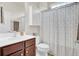 Bathroom featuring a white vanity top and shower with a patterned curtain at 349 Waterlily Way, Summerville, SC 29486