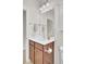Bathroom featuring a vanity with dark wood cabinets, brushed nickel hardware, and wall cabinet at 349 Waterlily Way, Summerville, SC 29486