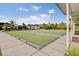 Angled perspective of bocce ball courts surrounded by manicured lawn at 349 Waterlily Way, Summerville, SC 29486