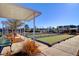 Wide shot of bocce ball courts with sun shelters and benches at 349 Waterlily Way, Summerville, SC 29486