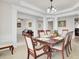 Open dining area with columns, neutral paint, views of other living spaces, and seating for six at 349 Waterlily Way, Summerville, SC 29486