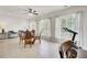 Bright dining area with windows, ceiling fan, wood table and four chairs at 349 Waterlily Way, Summerville, SC 29486