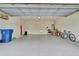 Well-lit garage features epoxy flooring, sink, and plenty of room for storage and activities at 349 Waterlily Way, Summerville, SC 29486