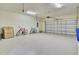 Spacious garage with epoxy flooring, overhead lighting, and ample storage space at 349 Waterlily Way, Summerville, SC 29486