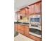 Chef's kitchen with stainless oven, microwave, and stylish backsplash at 349 Waterlily Way, Summerville, SC 29486