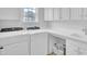 Well-lit laundry room with new white appliances, white cabinets, and a countertop folding area at 349 Waterlily Way, Summerville, SC 29486