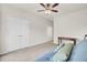 Bright living room with neutral carpet and a comfortable blue futon with decorative pillows at 349 Waterlily Way, Summerville, SC 29486