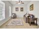 Cozy living room featuring neutral decor, a comfortable sofa, natural light, and a stylish area rug at 349 Waterlily Way, Summerville, SC 29486