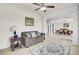 Inviting living room features neutral tones, tile flooring, and seamless transition to dining area at 349 Waterlily Way, Summerville, SC 29486
