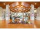 Lobby with high ceilings, fireplace, seating area and floor-to-ceiling bookshelves at 349 Waterlily Way, Summerville, SC 29486