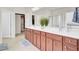 Bright main bathroom with double vanity and a walk-in closet at 349 Waterlily Way, Summerville, SC 29486